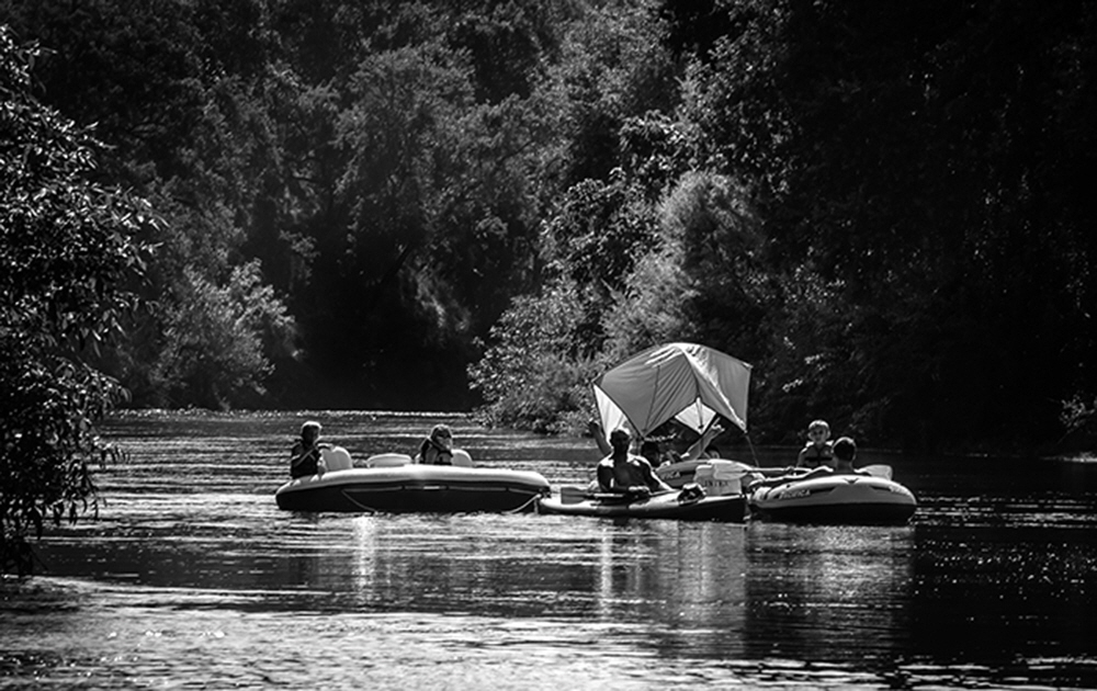 Through canyons of trees, riparian habitat,  and steep bluffs, floaters make their way from Sanger to Reedley, Ca. via the gentle section of the Kings.