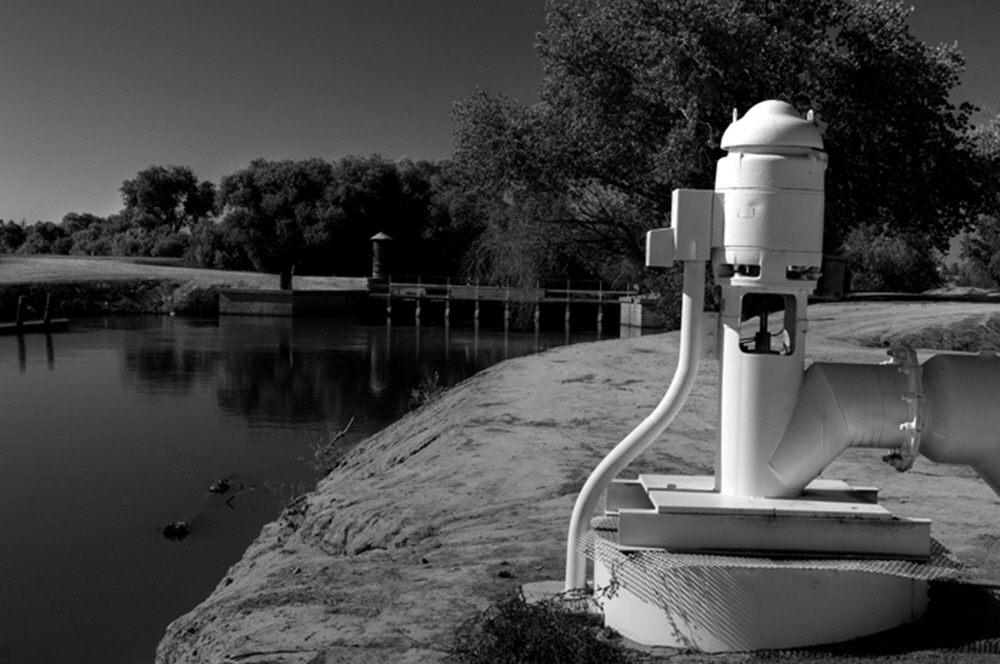 As the river turns into canals, pumps appear all along the canals to propel the water into the fields.