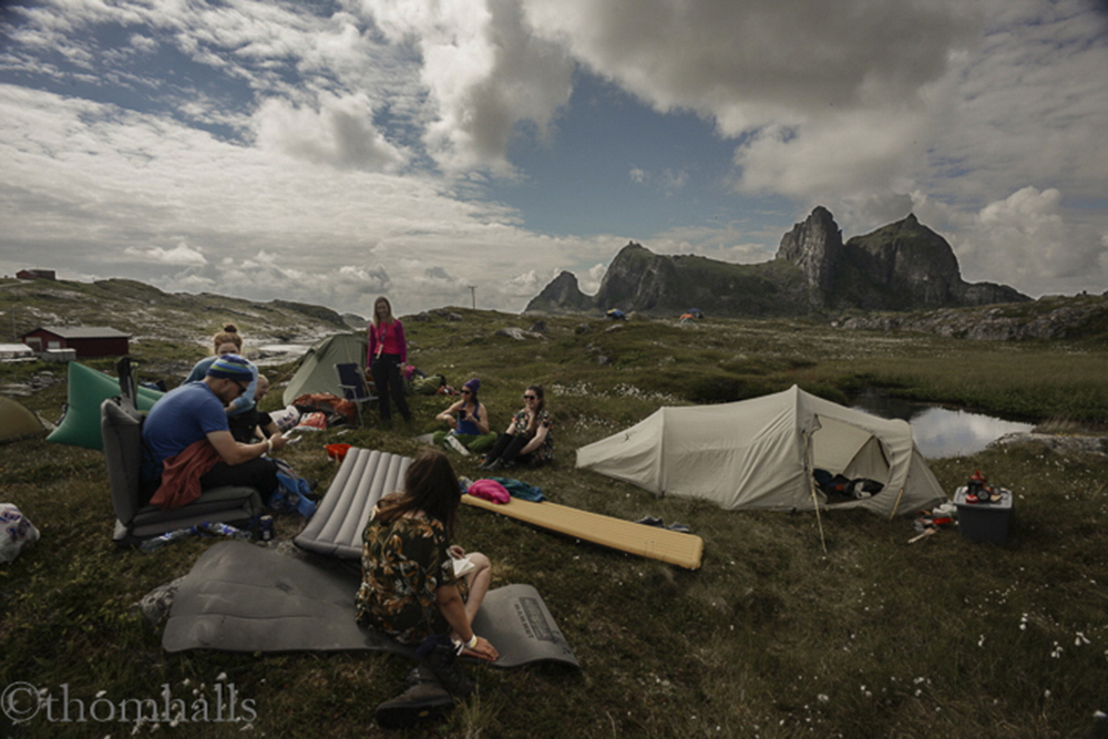 All over the hills of the island, small groupings of tents begin to form on Wednesday.  With no night fall, this arctic circle festival is just one continual party.  In the background is the island of Sanna. It is also called 'corpse island' not only because it looks like one, but it is the location of the island's cemetery.